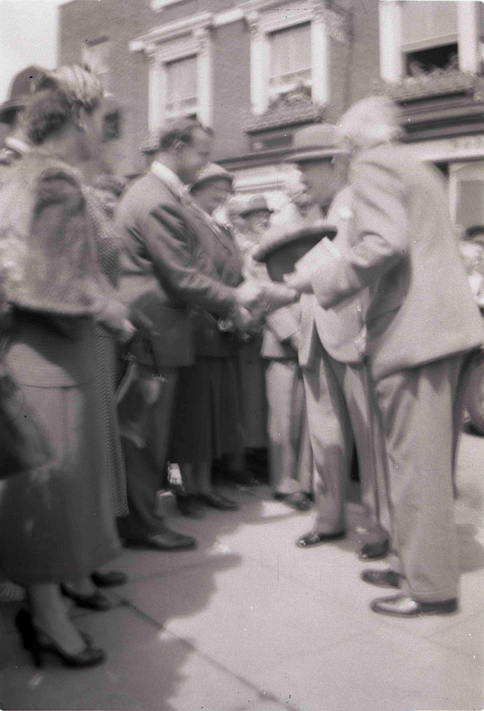 HELEN LONG (née Vlasto far left) and Dr AIDAN LONG welcoming Sir WINSTON CHURCHILL Westerham Carnival (early 1950s).jpg